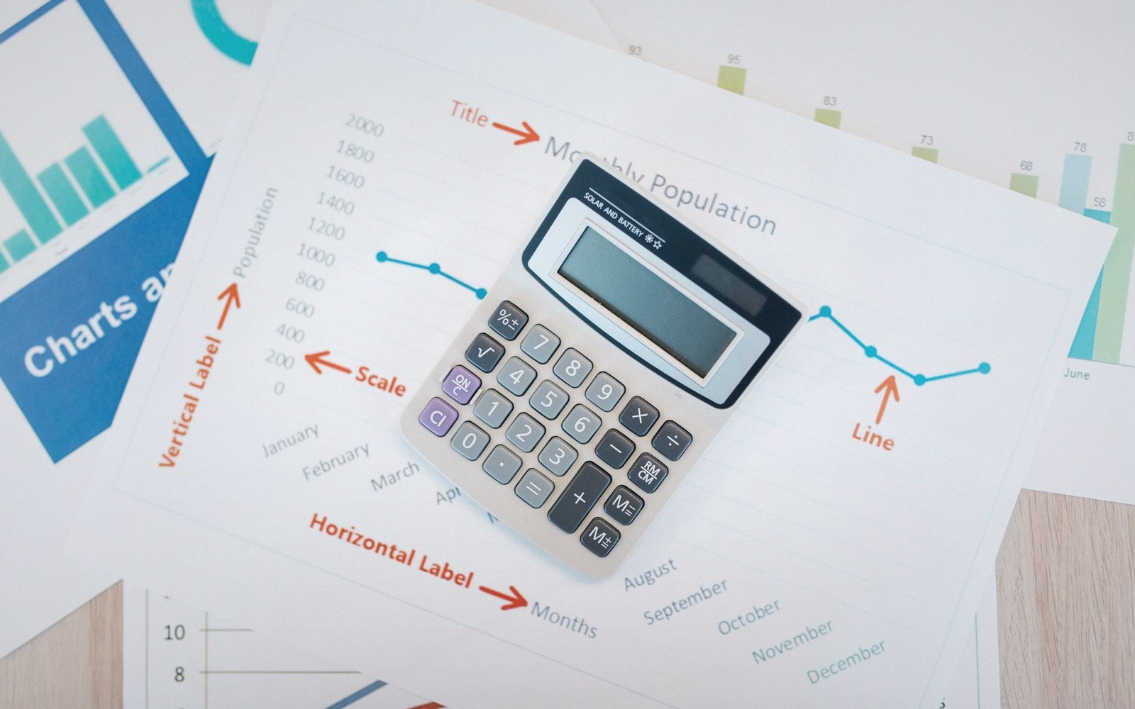 Papers, forms and reference volumes on a desk